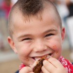 The BBQ at Ribfest sure put a smile on this little guys face!